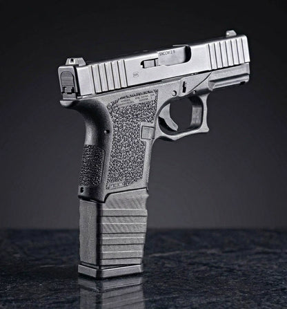 Glock 26 with 21rd GL9 PMAG and black magazine sleeve (a.k.a mag adapter or grip gap filler) installed